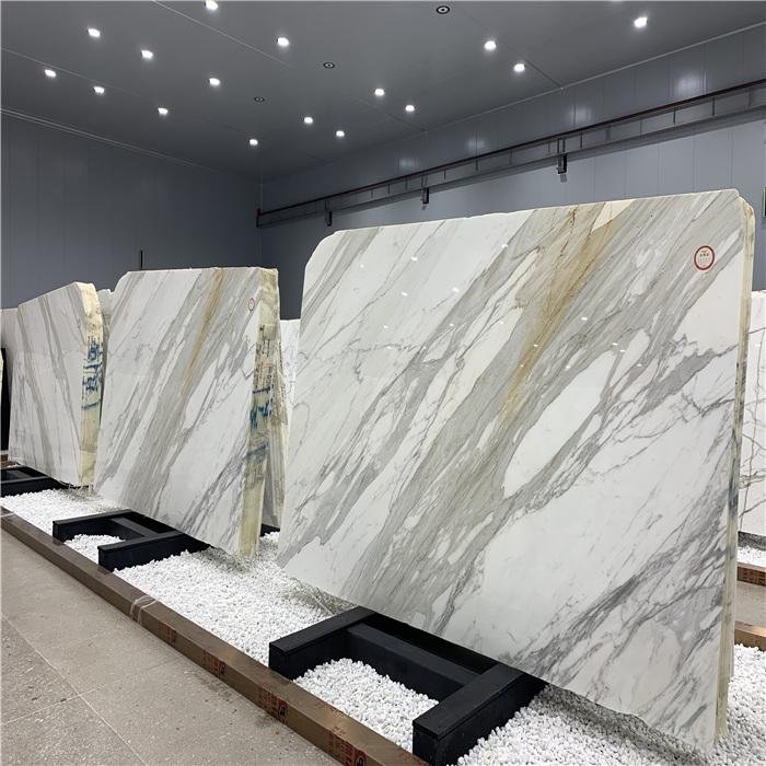 Large Italian marble slab sizes displayed in a natural stone warehouse